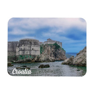 Fortress walls, rocky coast and sea in Croatia Magnet