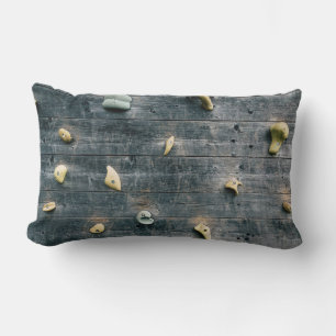 Four brown wooden wall decors lumbar cushion