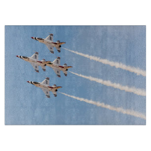 Four F-16 Thunderbirds fly in close formation Cutting Board