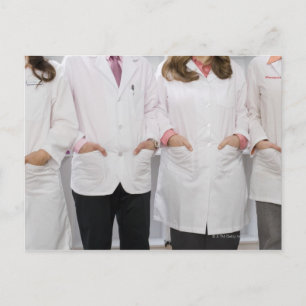 Four pharmacists with their hands in their postcard