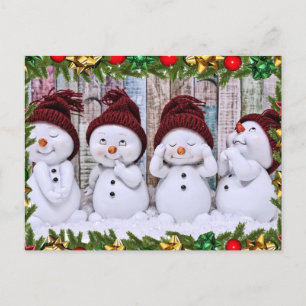 Four smiling toy snowmen postcard