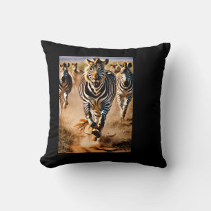 Four Zebras Running Across the Savanna While a Cushion