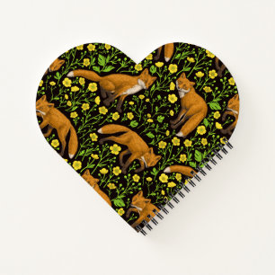 Foxes and buttercups on black notebook
