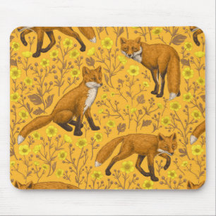 Foxes and buttercups on orange mouse pad