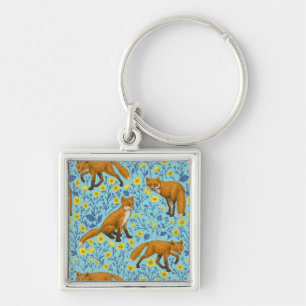 Foxes and buttercups on pool blue key ring