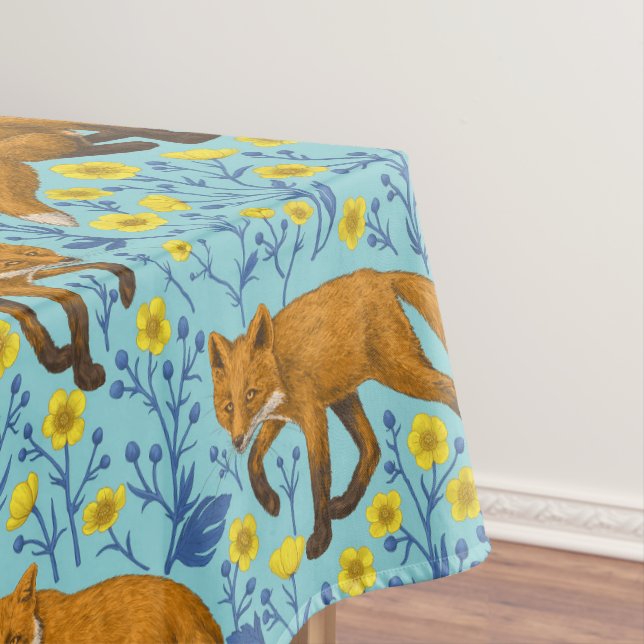 Foxes and buttercups on pool blue tablecloth (In Situ)