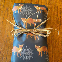 foxes with giant snowflakes on dark blue