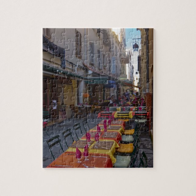 France, Corsica. Tables of cafe set up in narrow Jigsaw Puzzle (Vertical)