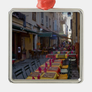 France, Corsica. Tables of cafe set up in narrow Metal Tree Decoration