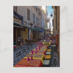 France, Corsica. Tables of cafe set up in narrow Postcard
