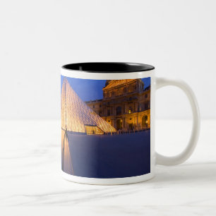 France, Paris. The Louvre museum at twilight. Two-Tone Coffee Mug
