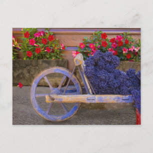France, Provence, Sault. Old wooden cart with Postcard