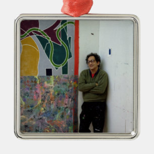 Frank Stella beside one of his works Metal Ornament