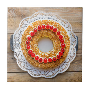 Frankfurt crown cake with cherries on rustic wood tile