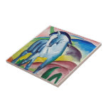 Franz Marc Famous Painting Blue Horse (1911)  Ceramic Tile<br><div class="desc">Franz Marc's Blue Horse (1911) is one his most iconic famous paintings. The blue horse is almost like a unicorn set against a vividly coloured landscape with hills of red, green, blue and yellow. He was a founding member of Der Blaue Reiter (The Blue Rider), a journal whose name became...</div>