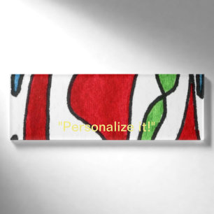 Free form organic shapes in red, green and blue name tag