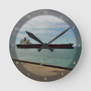 Freighter ship sailing on sea round clock