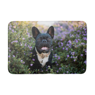 French Bulldog Stands in Flowers Bath Mat