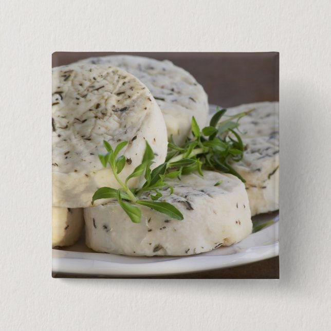 French goat cheese - chevre - with herbs on a 15 cm square badge (Front)