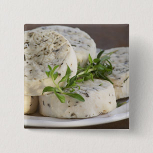 French goat cheese - chevre - with herbs on a 15 cm square badge