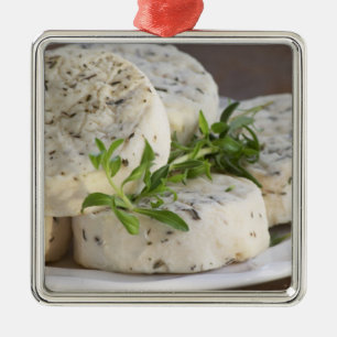 French goat cheese - chevre - with herbs on a metal ornament