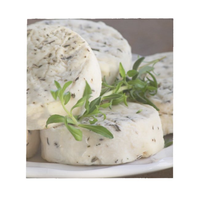 French goat cheese - chevre - with herbs on a notepad (Front)