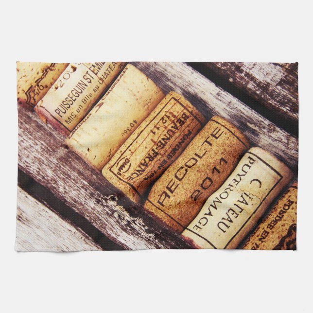french wine bottle corks on rustic wooden texture tea towel (Horizontal)