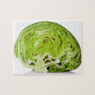 Fresh iceberg lettuce cut in half, on white jigsaw puzzle