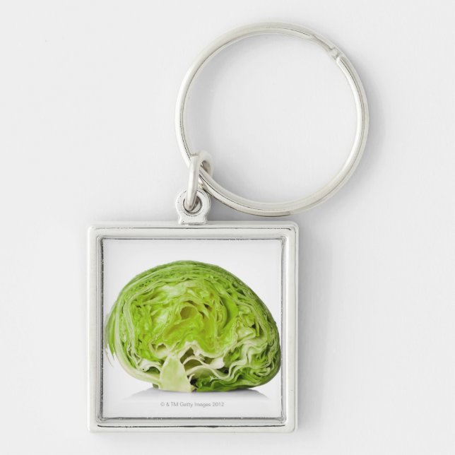 Fresh iceberg lettuce cut in half, on white key ring (Front)