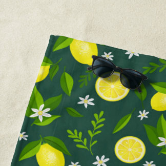 Fresh lemons with flowers and leaves beach towel
