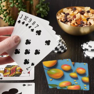 Fresh mangoes on blue playing cards