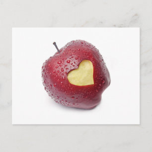 Fresh red apple with a heart shaped symbol postcard