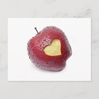 Fresh red apple with a heart shaped symbol postcard