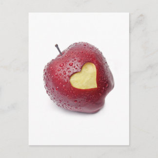 Fresh red apple with a heart shaped symbol postcard