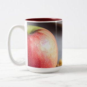 Fresh red apples on the table, apple pie crumbs Two-Tone coffee mug