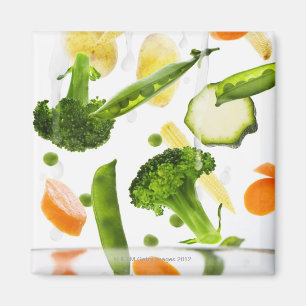 Fresh vegetables with water falling into a bowl magnet