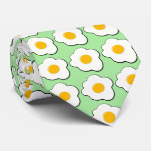 fried eggs for breakfast with green background tie