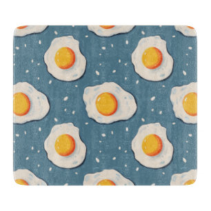 Fried Eggs on Blue Cutting Board
