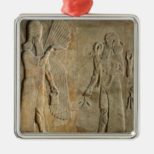 Frieze depicting a winged spirit metal tree decoration