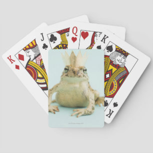 Frog wearing crown playing cards