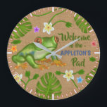 Frog Welcome to the Pad Tropical Personalised Name Large Clock<br><div class="desc">This pretty,  custom round clock includes an original drawing of a frog surrounded by hand-drawn tropical leaves and flowers. The background image is made to look like burlap. Use the template to easily add your own name. Choose your own clock size.</div>