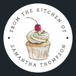 From the Kitchen Of | Cupcake Custom Classic Round Sticker<br><div class="desc">Custom sticker for the bakers and cooks that like to bake/cook and gift to others, or for those who do that professionally. There is an illustration of a vanilla cupcake with whipped cream and cherry in the middle. There is text that goes around in circle that says "From the kitchen...</div>