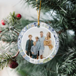 Frosty Winter Foliage Greenery Photo Christmas Ceramic Ornament<br><div class="desc">This elegant and classic holiday photo ornament features a beautiful circular watercolor frame of leaves, berries, and other greenery over a dusty blue background. The botanical illustrations are continued on the back. The greeting on the back is editable and in a classic serif font. There you can add the year...</div>