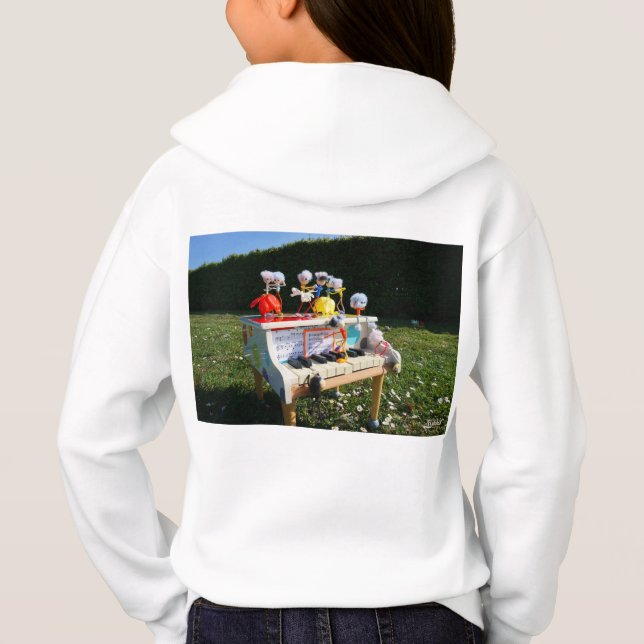 Fubbies on the piano making and dancing music. (Back)