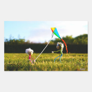 Fubby's playing together with a kite. rectangular sticker