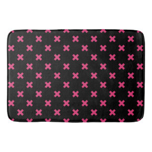 Fuchsia cross stitches on black bath mat