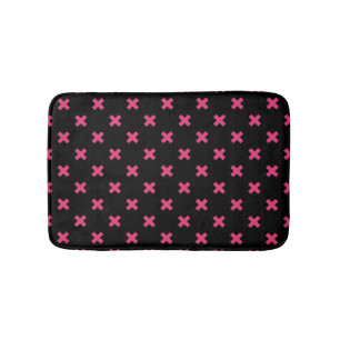 Fuchsia cross stitches on black bath mat