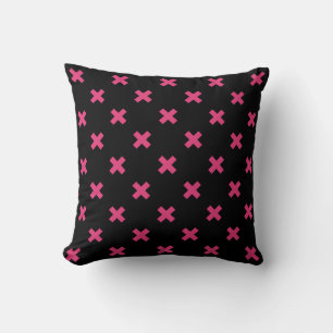 Fuchsia cross stitches on black cushion