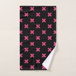 Fuchsia cross stitches on black hand towel