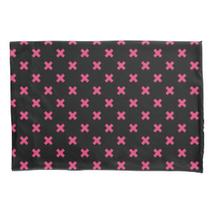Fuchsia cross stitches on black pillowcase